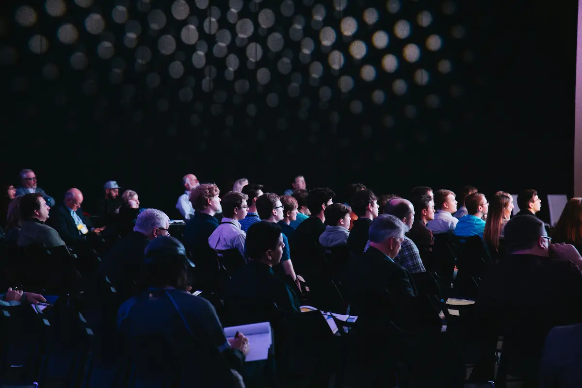 Business professionals discussing opportunities at a conference