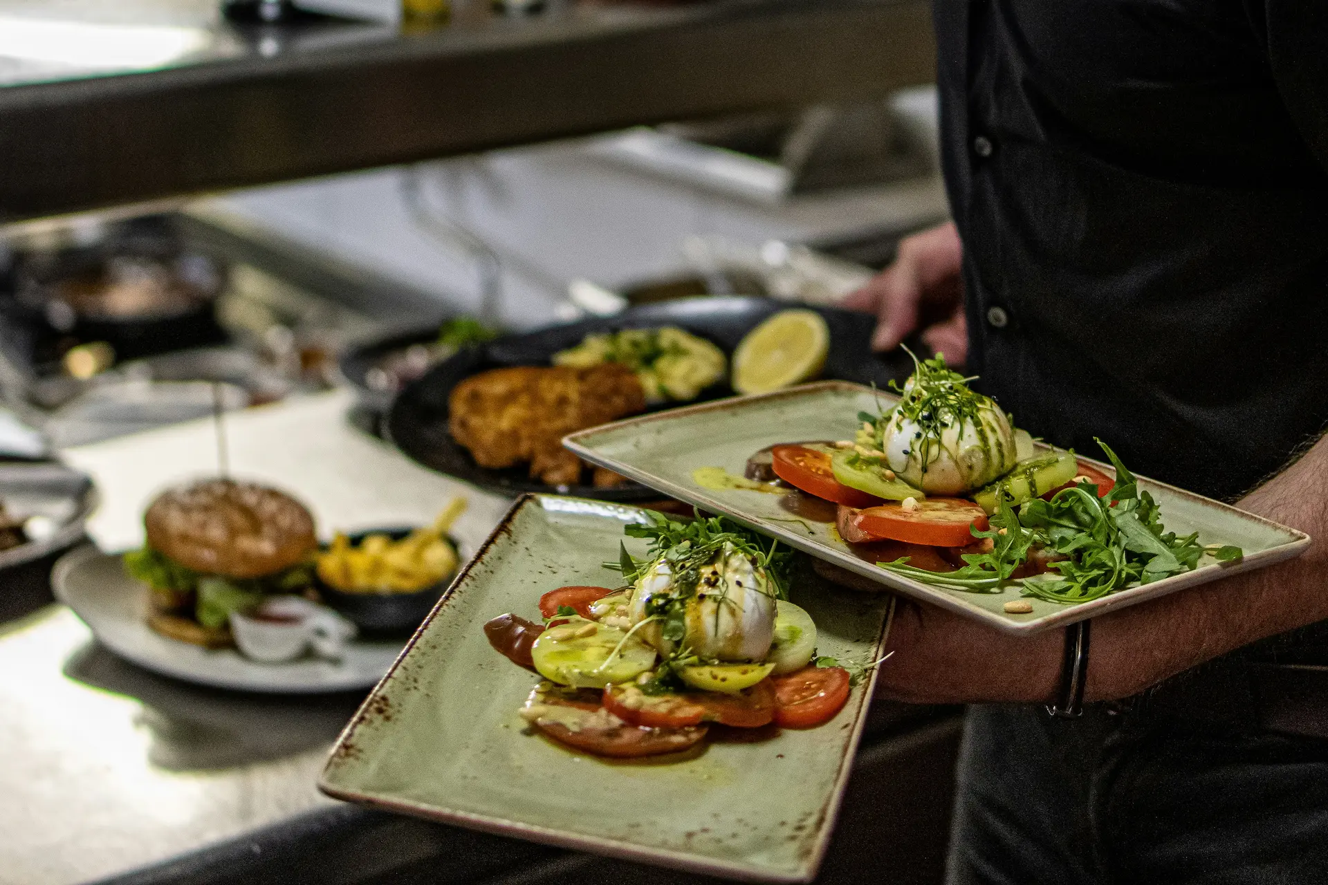 Chef presenting a beautifully plated culinary dish